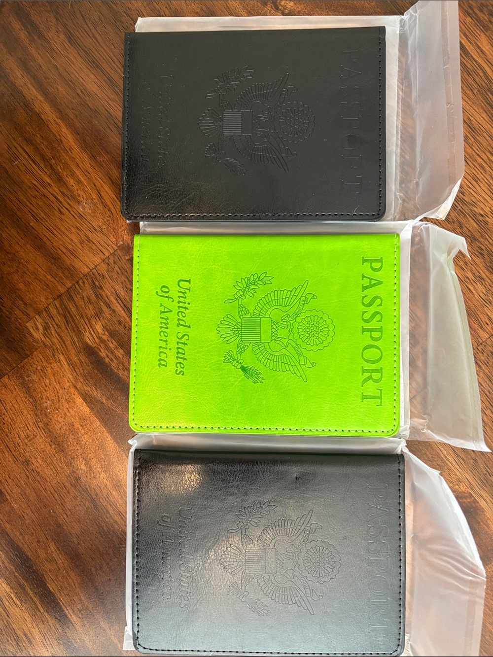 3 Passport Covers - 1 Neon Green and 2 black Travel Wallet